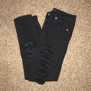 Black extremely ripped jeans